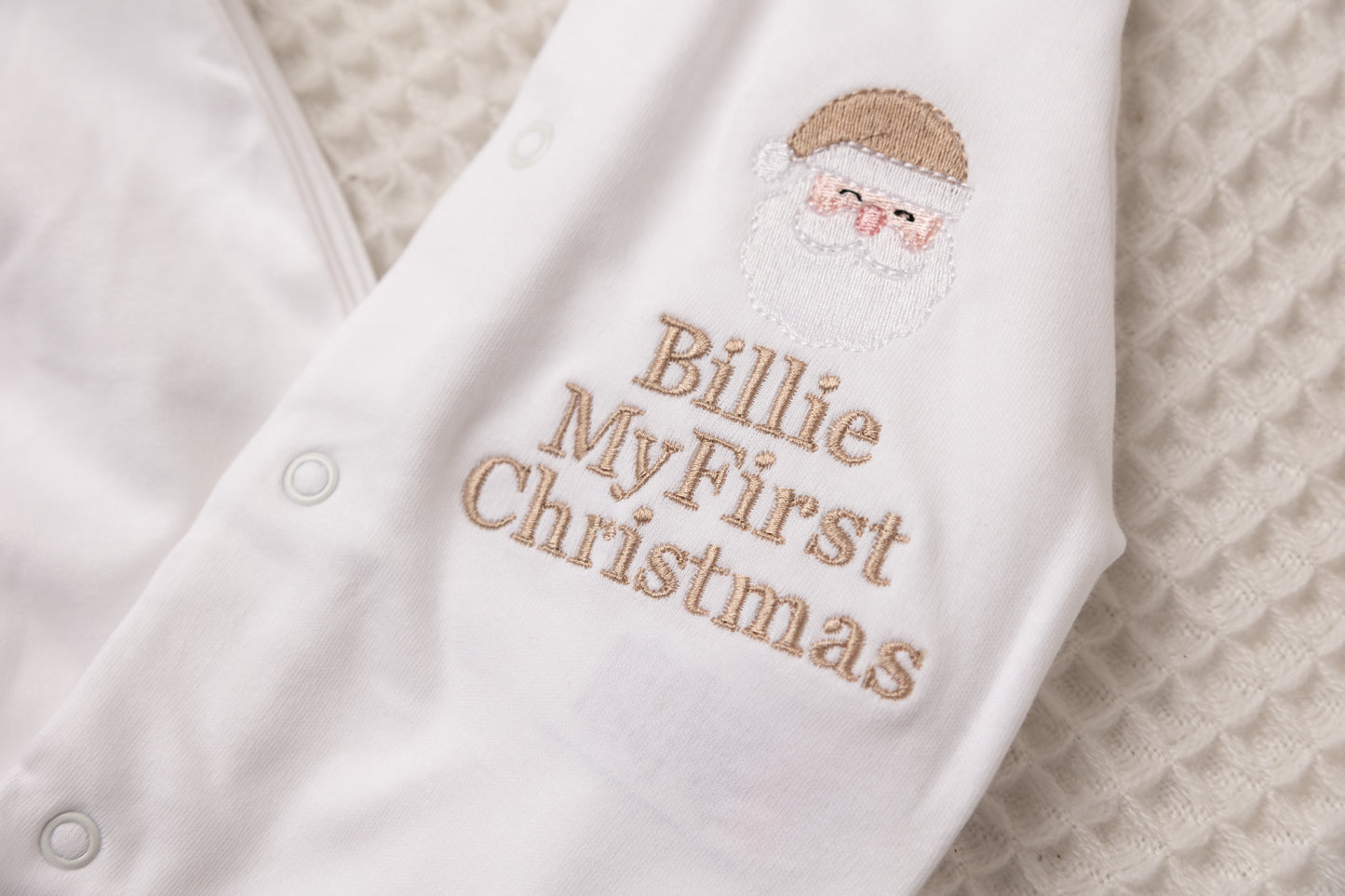 White button babygrow first Christmas Santa face